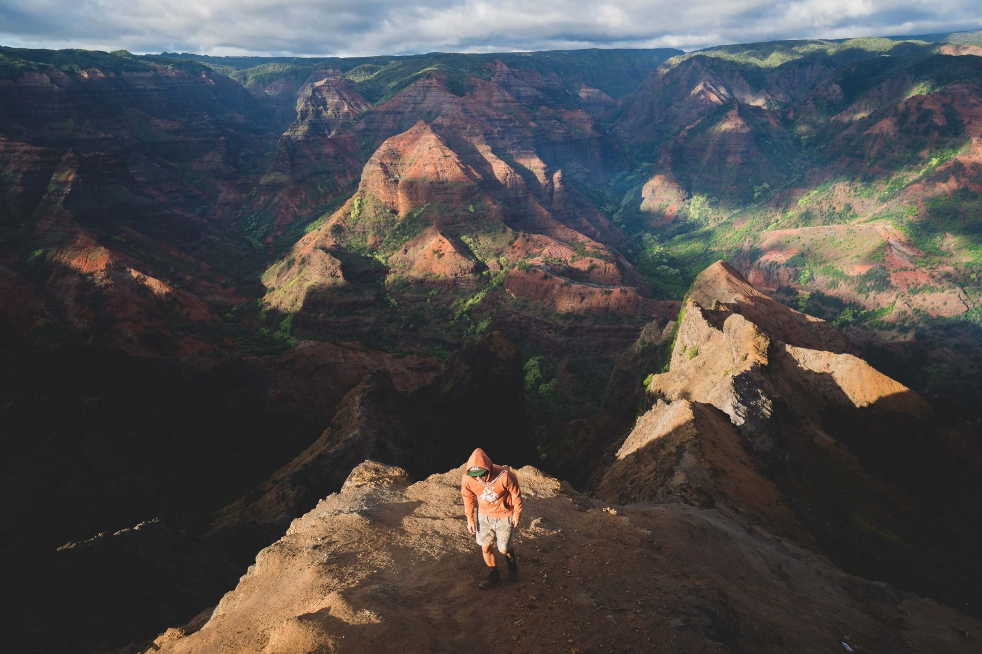 a-man-having-fun-hiking-the-waimea-canyon-of-kauai-hawaii