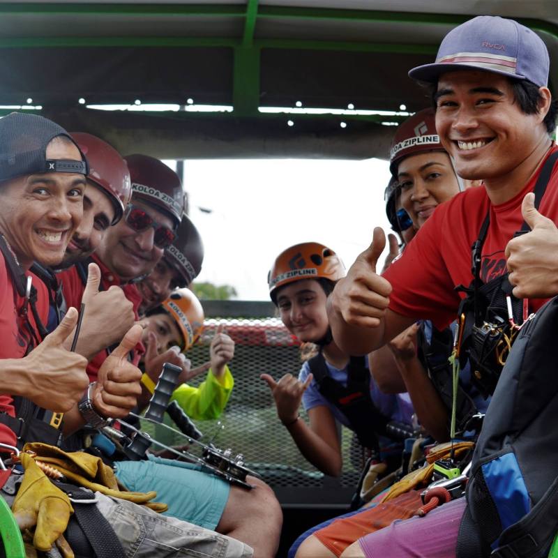 a group of people riding on the back of a boat