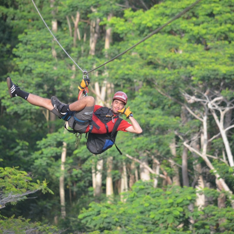 Darren Ang flying through the air while riding skis